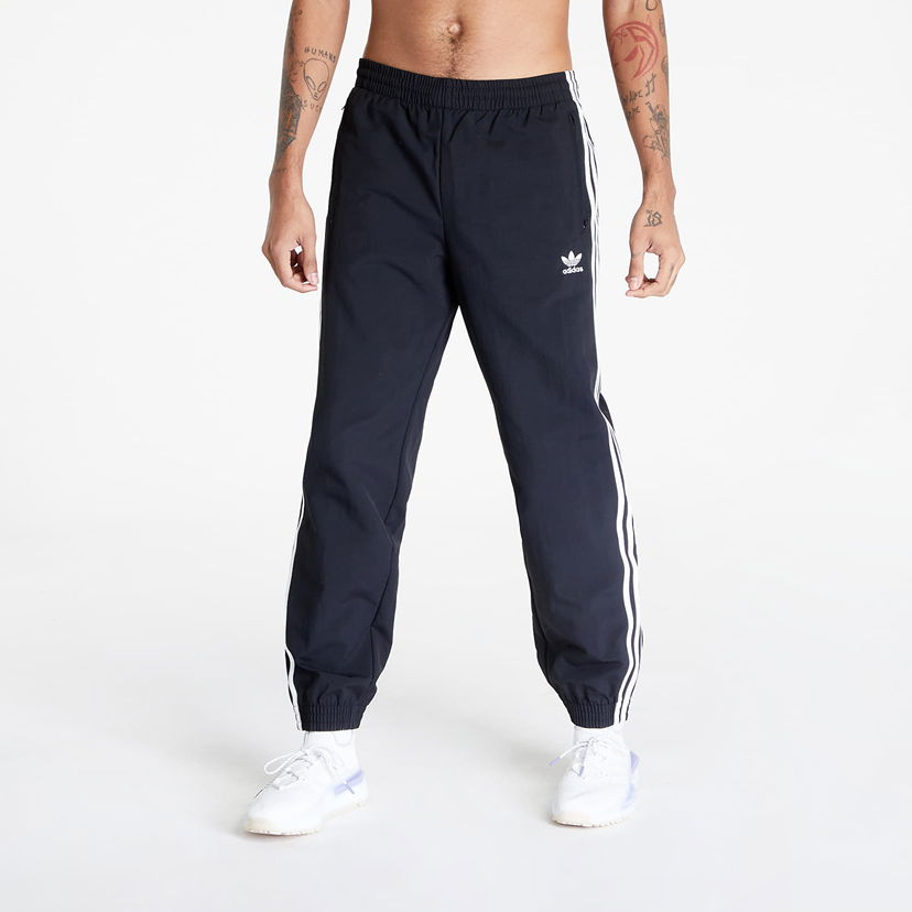 Штани і джинси adidas Originals adidas Woven Fbird Track чорний | IT2501