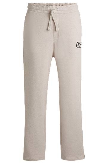 Спортивні штани BOSS Embroidered Cotton-Terry Tracksuit Bottoms бежевий | 50545938